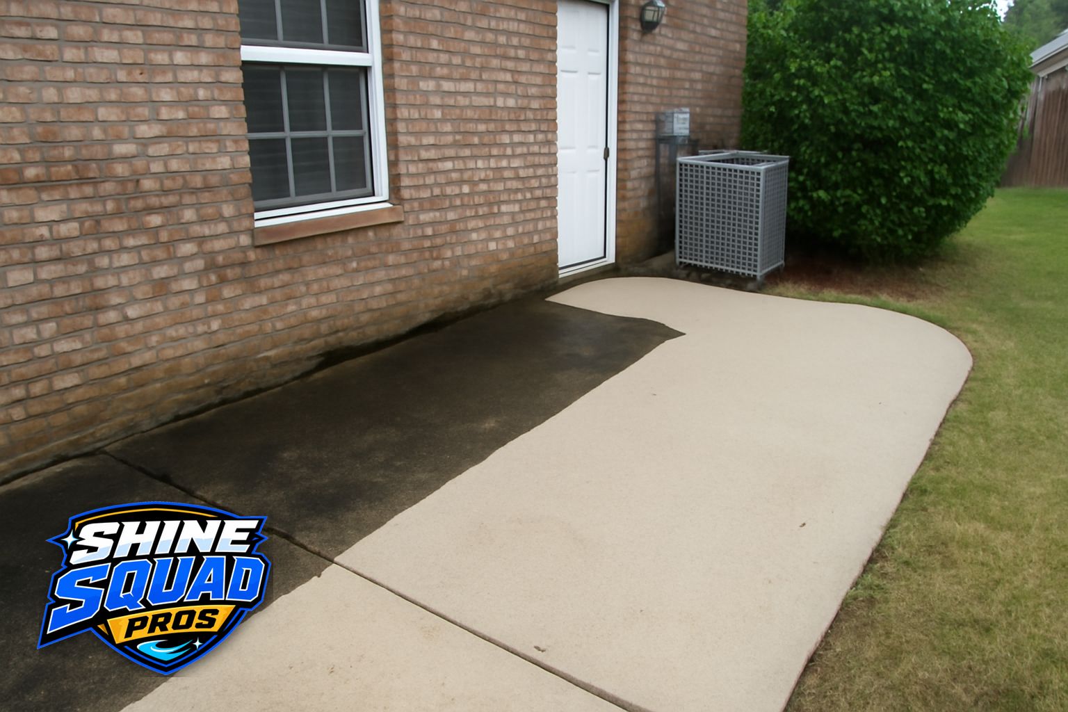 Technician soft washing a two-story home exterior in Roswell, Georgia