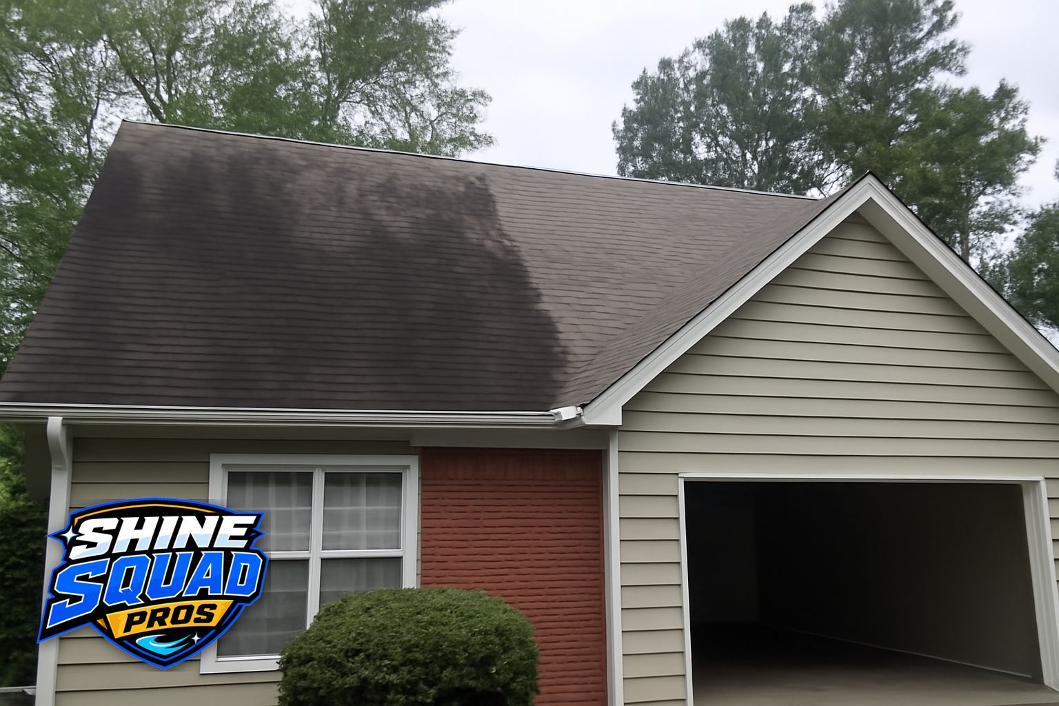 Exterior cleaning technician applying soft wash solution to a roof in Decatur, GA using low-pressure equipment